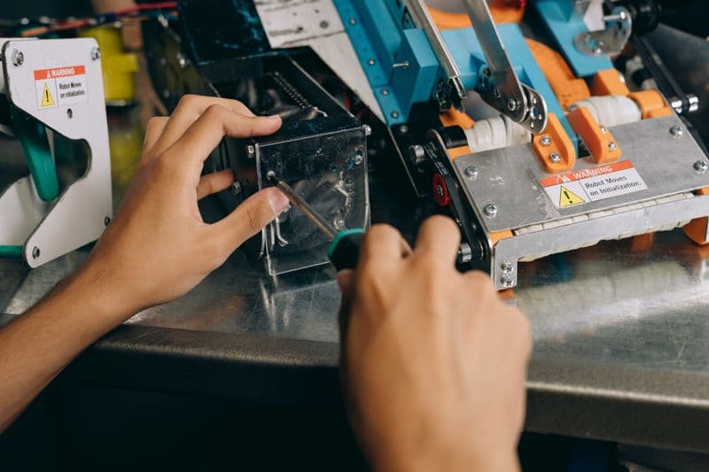 Technician servicing a machine
